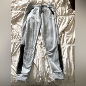 grey and black North Face womens sweatpants (size M)